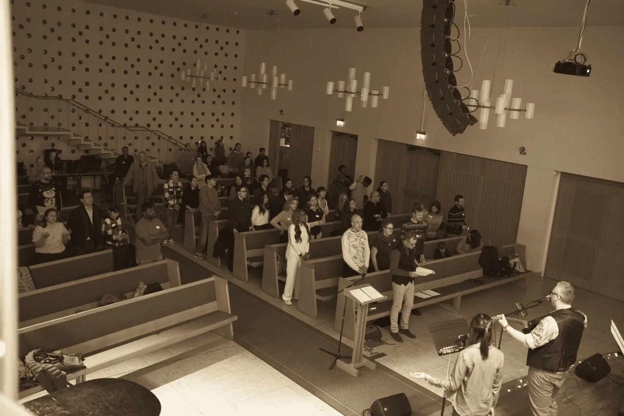 The worship team leading a Sunday service at Betlehemskyrkan, seen from the balcony