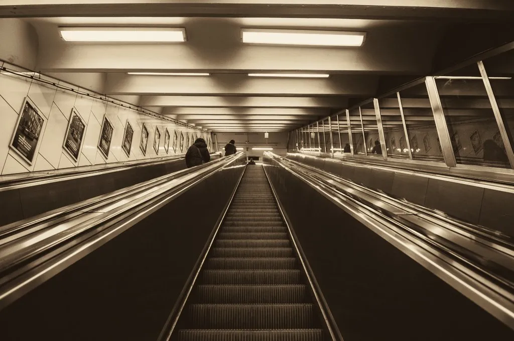 A long escalator rising out of a Stockholm metro station
